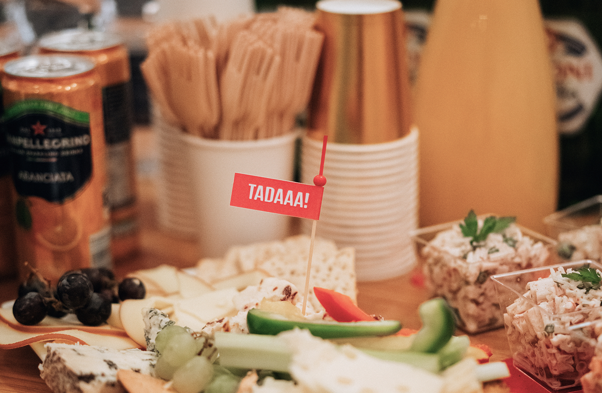 Party food spread with TADAAA! flag